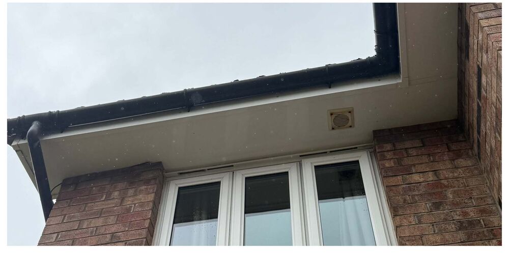 Bright white soffit and clean guttering after washing